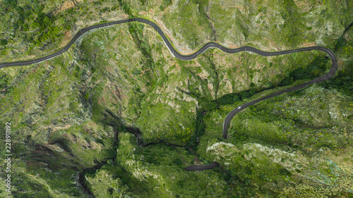 drone top view bended road on mountain of Paul do Mar, Madeira island, Portugal