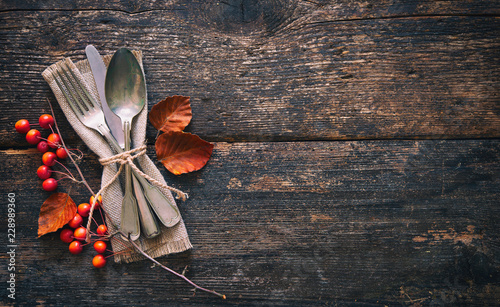 Autumn background with vintage place setting on old wooden table