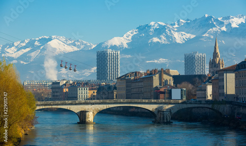 Grenoble with cable car against backdrop of snowy Alps