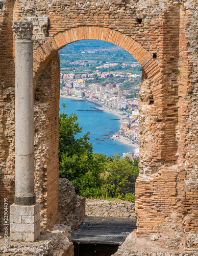 Ruins of the Ancient Greek Theater in Taormina with the sea in the background. Province of Messina, Sicily, southern Italy.