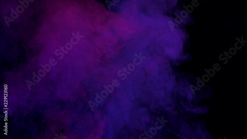 violet and pink bomb smoke on black background