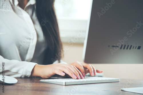 woman hand computer keyboard on table