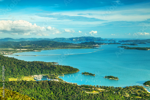 View of tropical island Langkawi and cable car in Malaysia, covered with tropical forests as seen from the sky bridge. 