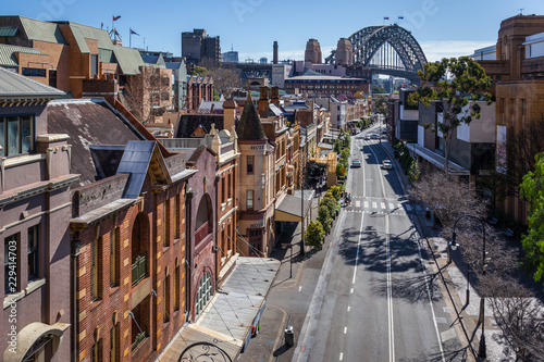 View of George Street in the Rocks, the historic district of Sydney. In the background, the harbour Bridge.