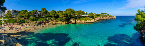 Beautiful wide panorama of Esmeralda beach in Cala d'Or on the coast of Mediterranean sea in Mallorca Balearic Islands