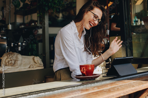 Businesswoman at cafe making a video call