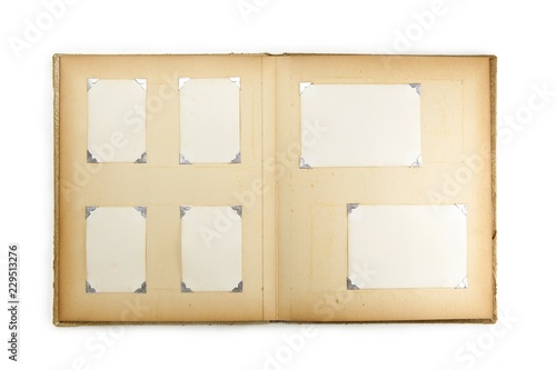 1950s photo album, opened with six pictures, isolated on white.