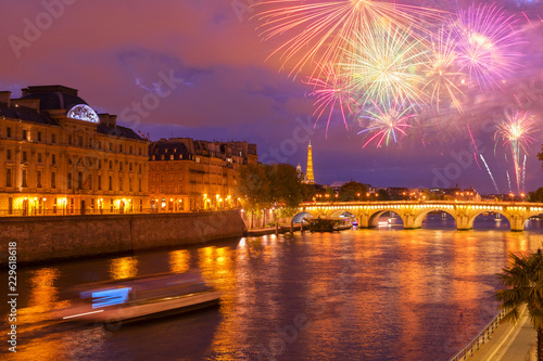 Pont Neuf and Cite island over Seine river with Paris cityscape and fireworks at night, France