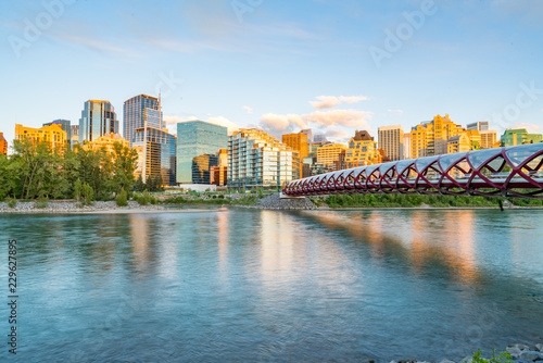 Skyline of the city Calgary, Alberta, Canada along the Bow River with Peace Bridge