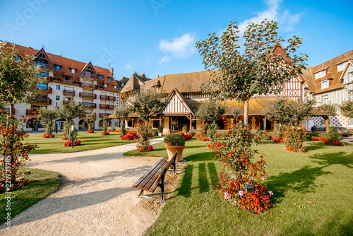 Beautiful garden with luxury hotel building in the center of Deauville city, famous french resort in Normandy