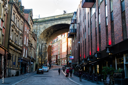 NEWCASTLE UPON TYNE, ENGLAND - JANUARY 28, 2018: City centre of Newcastle upon Tyne in north east England, United Kingdom. Tyne Bridge in the background