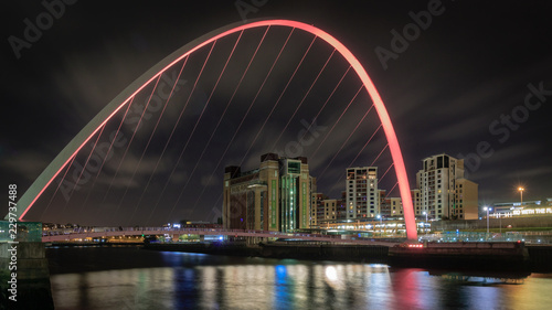 a view of the gateshead quayside at night