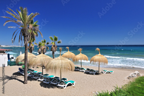 Beach in the popular resort of Marbella in Spain, Costa del Sol, Andalucia region, Malaga province.