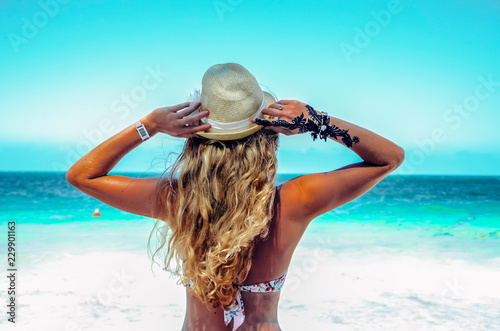 Blonde woman girl on a blue sea ocean paradise view