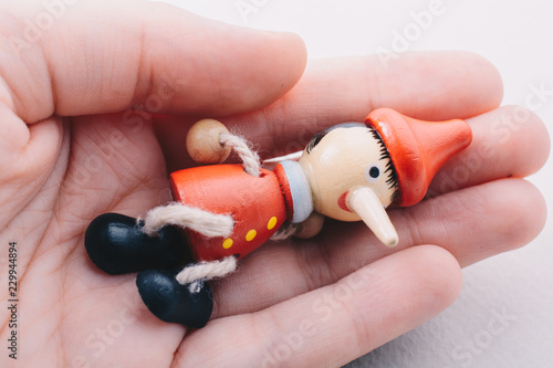 Wooden pinocchio doll with his long nose