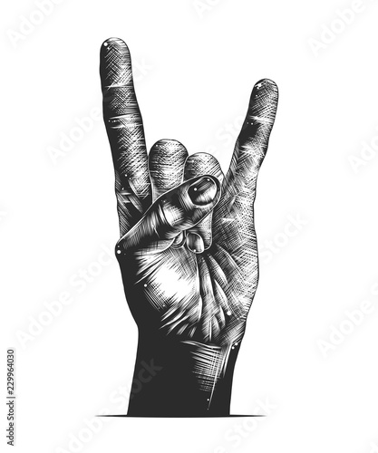 Vector engraved style illustration for posters, decoration and print. Hand drawn sketch of rock sign gesture in monochrome isolated on white background. Detailed vintage woodcut style drawing.