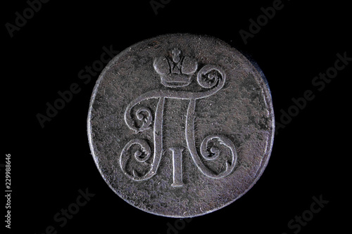 old Russian coin 1 Denga 1798 on black isolated background