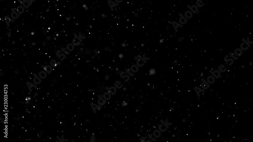 White Snow Falling on Isolated Black Background, Shot of Flying Snowflakes Bokeh, Dust Particles or Powder in the Air. Holiday Overlay Effect