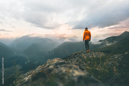 Man adventurer on mountain summit hiking Traveling alone heathy lifestyle active vacations trail running outdoor