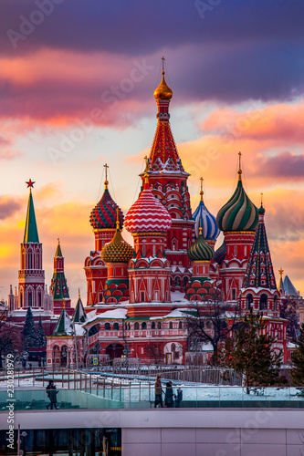 Moscow, Capital city of Russia. Beautiful view of Saint Basil`s Cathedral during sunset time. Clouds are in purple and orange colors.