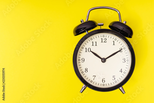 Black alarm clock, concept of time