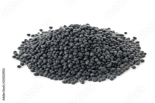 Heap of black organic beluga lentils on white