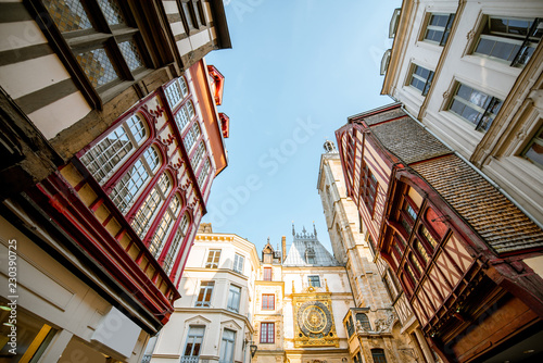 Street view with ancient buildings and Great clock on renaissance arch, famous astronomical clock in Rouen, the capital of Normandy region