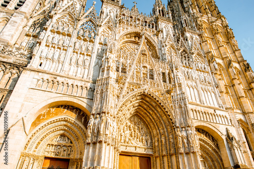 Close-up view from below on the facade of the famous Rouen gothic cathedral in Rouen city, the capital of Normandy region in France