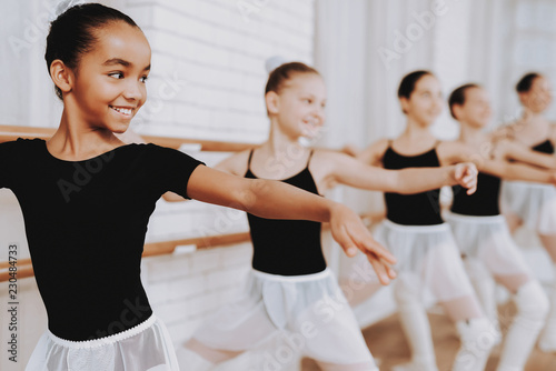 Ballet Training of Group of Young Girls Indoors.