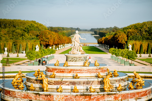 Versailles gardens with Latona fountain and Grand canal during the morning light in Versailles, France
