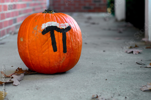 A visual pun for pumpkin pie on a Halloween pumpkin