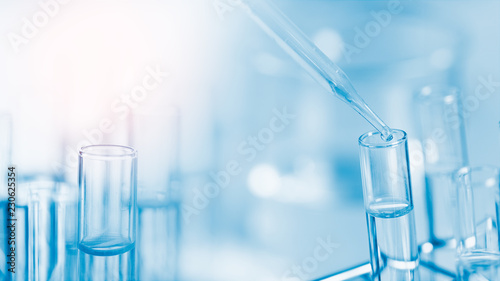 Dropping chemical liquid to test tube, laboratory research and development concept. scientist sample chemistry or medicine test