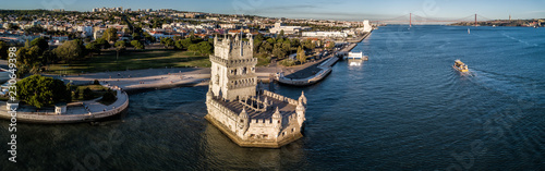 Aerial drone photo of the Belem Tower (Belém Tower) at sunset. A medieval castle fortification on the Tagus river of Lisbon Portugal