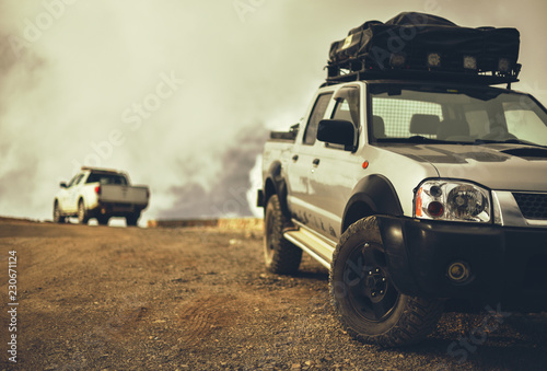 SUV pickup with trunk of roof on mountains road