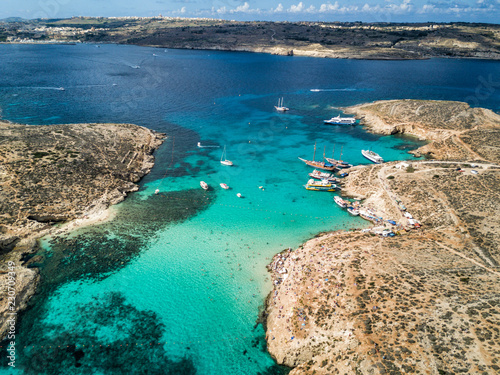 Aerial drone photo - The famous Blue Lagoon in the Mediterranean Sea. Comino Island, Malta. 