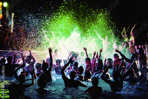 Night party of people in the pool.