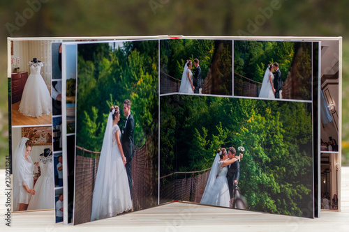 Open pages of brown luxury leather wedding book or album