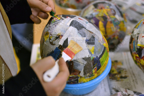 Children hands are making a bowl.