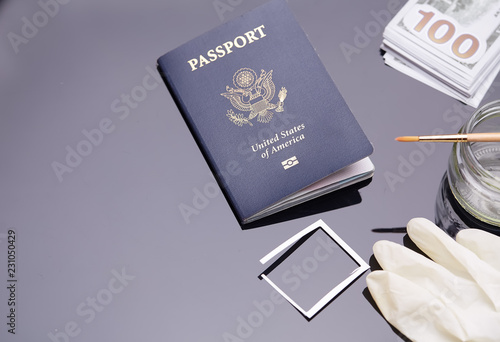 Passport of United States of American. Traveling passport. closeup of an american passport and money. Concept of counterfeiting documents.