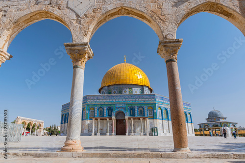 Ancient arch and Dome of the Rock Mosque in Jerusalem, Israel.