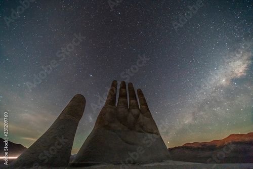 The amazing Mano del Desierto (Desert Hand) with a Milky Way in the southern hemisphere and the Magellan Clouds galaxies with millions of stars around the night sky just amazing. Chile Nightskies 