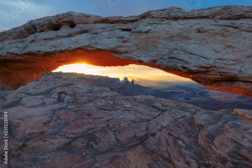 Sunrise at Iconic rock formation - Mesa Arch in Canyonlands National Park, Moab, Utah, USA.
