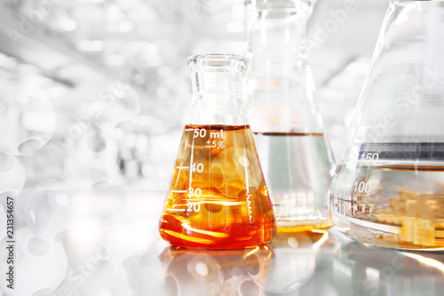 orange so in conical three flasks with chemical structure in science education laboratory