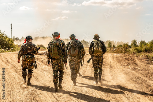 group of soldiers on the Outdoor on army exercises. war, army, technology and people concept