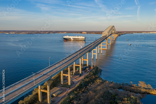 Aerial view of Francis Scott Key Bay bridge over the Patapsco river in Baltimore Maryland with ships