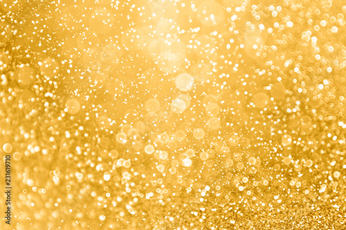 Gold glitter sparkle glam background texture for golden Christmas sparks, wedding anniversary or birthday