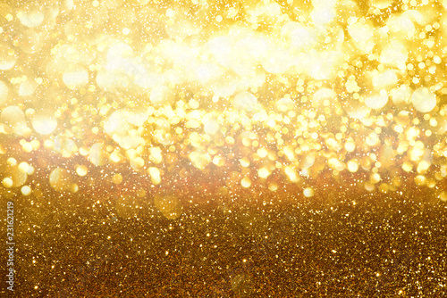 gold glitter lights texture bokeh abstract background. defocused