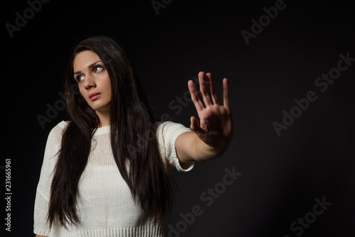 White caucasian girl posing emotionally isolated on background