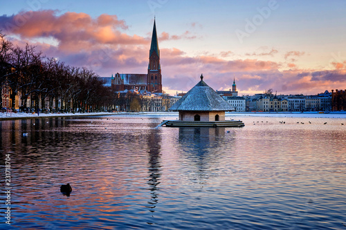 Duck house on the lake. Panorama from the Pfaffenteich lake in the city of Schwerin.