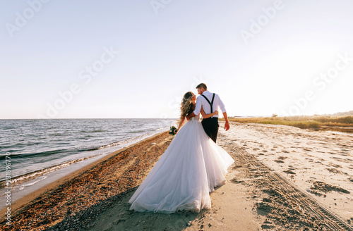 bride and groom on the seashore. wedding concept on the sea, on a fabulous island.